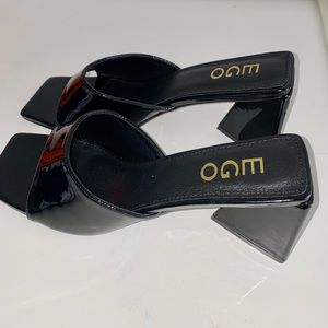 EGO official peep toe sculptured flared block heel mule in black.